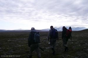 Chad, Bob, and Jeff walking through the tundra of Alaska to fish Morain Creek with the local brown bears.