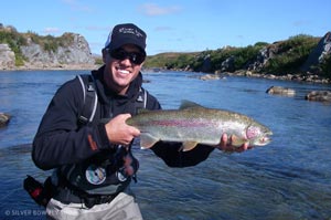 Sean Visintainer with a large Morain Creek rainbow caught on a Purple Egg Sucking Larimer Loop Leech.