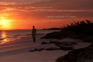 Sean Visintainer admiring a Bahama sunset on one of the many white sandy beaches. Seconds after this photo a 100+ pound tarpon went airborne about 50 yards from the shore... timing is everything. 
