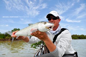 Sean holding a hefty Bahama Bonefish for the camera. 