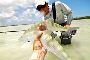 Mike and Sean Visintainer with a double hookup on large Bonefish. This shot was actually incredibly hard to get when you don't have a third person! The fish accidentally drenched Mike's Nikon right as he shot the photo.