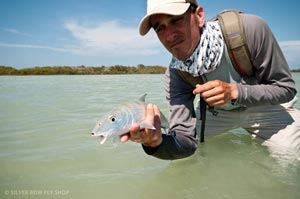 Mike Visintainer holding one of his last Bonefish he caught in the final hour of fishing the last day.