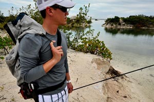 Sean Visintainer scouting for fishy activity in the canals connecting the salt pond flats.