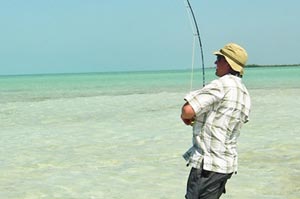 Sean putting what little muscle he has into fighting a Bonefish on a sandy flat just west of downtown San Pedro.