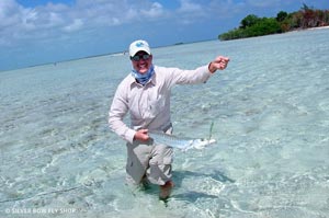Sean Visintainer with a nice couple foot long barracuda caught near San Pedro, Belize.