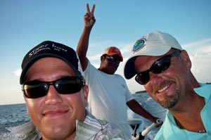 Sean Visintainer, Doug Brady, and guide Parnel cruising the flats of Belize during the tournament.
