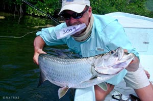 Doug Brady going for the slam with his tarpon he caught after the second permit in the tournament.