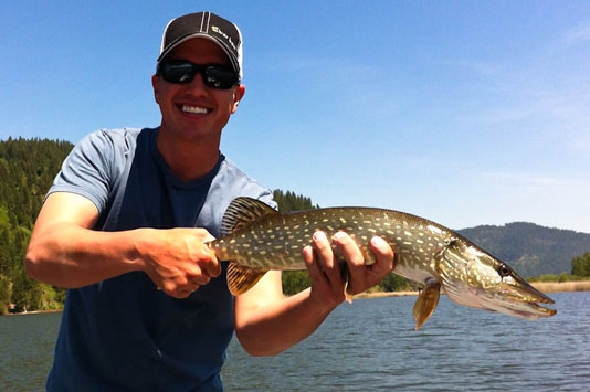 Sean with a Killarney Lake Pike caught on a fly rod.
