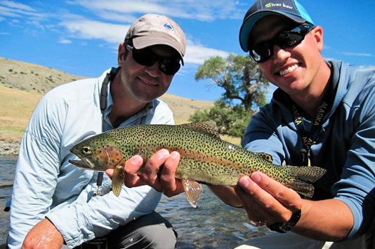Miles McGeehan and Sean Visintainer holding a nice trout on the Boulder River.