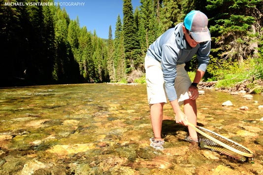 Sean landing a Westslope Cutthroat Trout in his wood net!