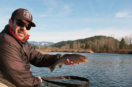 Mark holding a nice cutty on the Coeur d'Alene River.