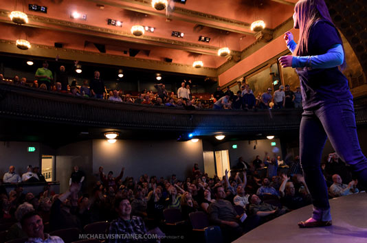 Tossing out freebies into the crowd at the Bing Crosby Theater.