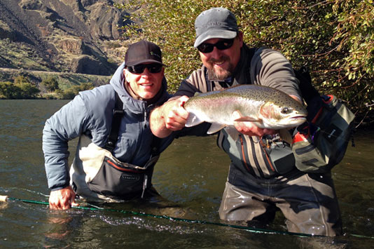 John Stejer and Tom Larimer with a Deschutes River Steelhead to hand.