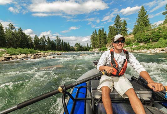 Sean Visintainer rafting the Spokane River in the Valley.