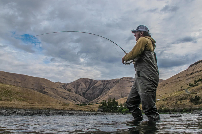 Fish on! Kenyon fights a steelhead on the Grande Ronde River.
