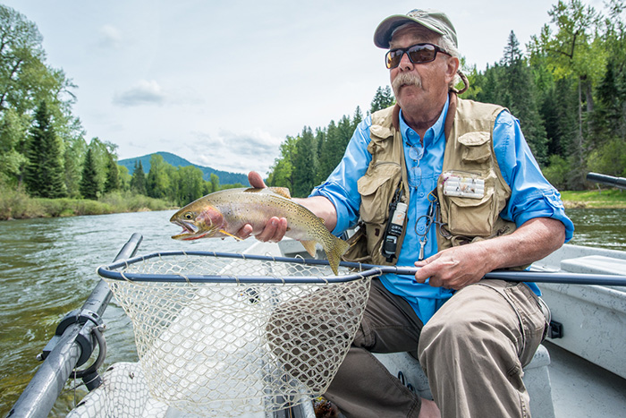 Bill Johnson hoists a nice cutthroat trout from the Coeur d'Alene River in Idaho. 