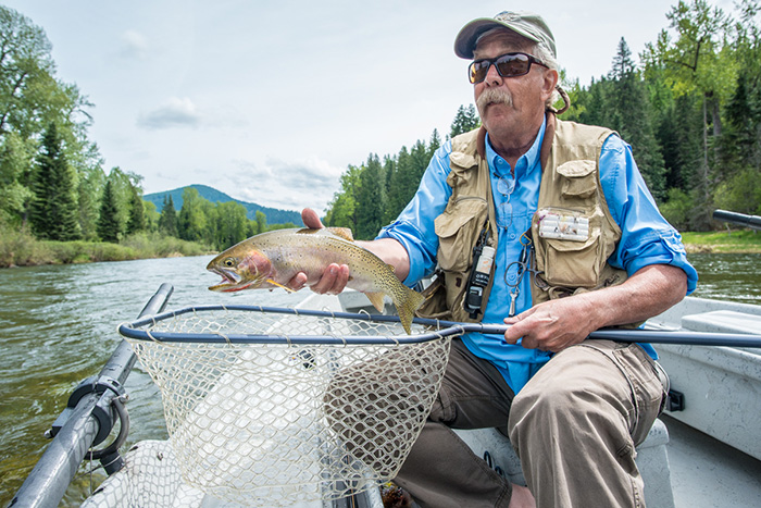 Bill Johnson hoists a nice cutthroat trout from the Coeur d'Alene River in Idaho.