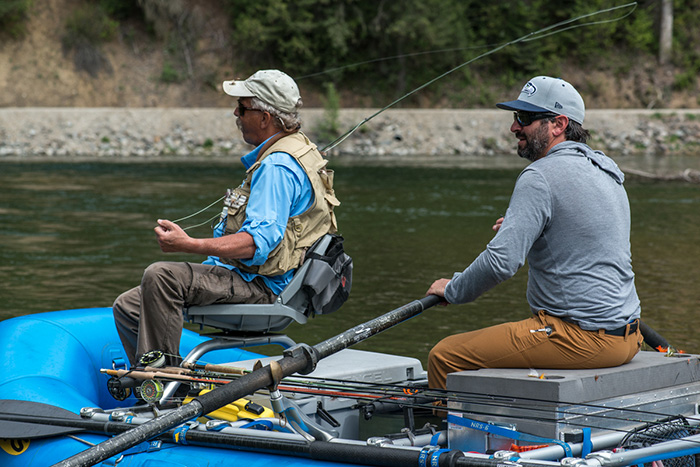 Bo Brand rows North Fork Coeur d'Alene River fly fishing guide Bill Johnson around for a chance to catch cutthroat trout.