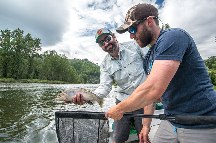 Greg Gatti, St. Joe River Guide, and Bo Brand admire a beautiful cutthroat.