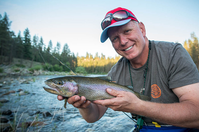 Otto Klein from the Spokane Indians Baseball Team enjoys late evening fly fishing on the Spokane River with the nice dry fly caught Redband Trout.