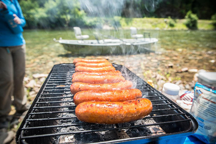 Streamside lunch while fly fishing the St. Joe River in Idaho for cutthroat trout with an Adipose Flow Skiff drift boat.