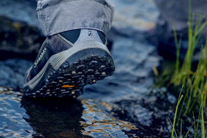 Simms Flyweight Boot is flexible and studdable for extra traction on slick streamside rocks.