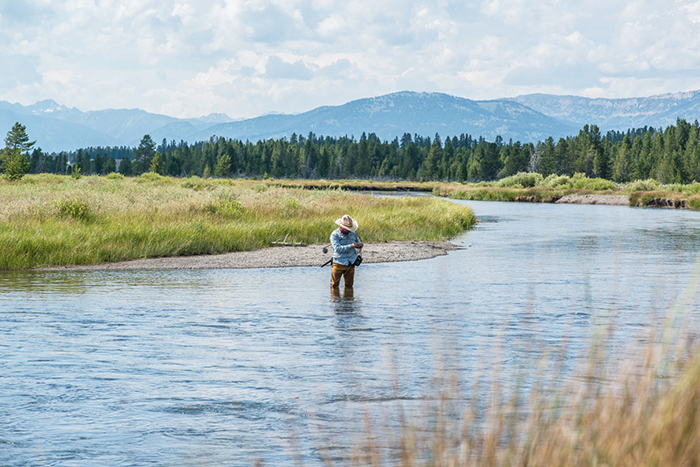 Rigging new flies while Euro nymphing the Madison River in Montana near West Yellowstone.