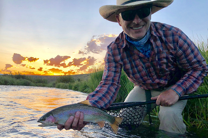Ben Visintainer with a quality rainbow from the Madison River near Reynolds Pass.