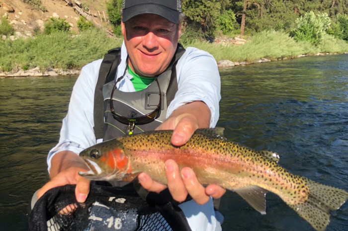 Guest Kevin West on a Spokane River guided fly fishing trip.