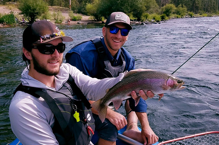 Spokane River fly fishing guide Kenyon Pitts with a chunky Redband trout.