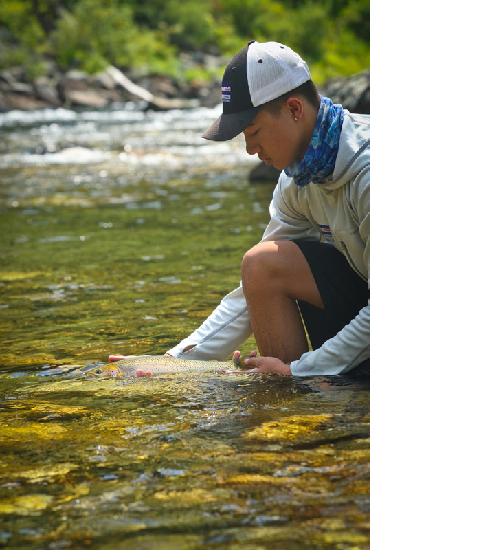 Teddy Covich releasing a stellar cutthroat on the St. Joe River, Idaho. Jon Covich Photo.