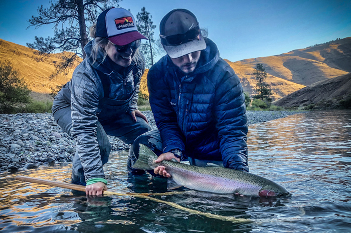 Silver Bow steelhead guide Kenyon Pitts and Mikayla Zivic with a beautiful Grande Ronde steelhead.