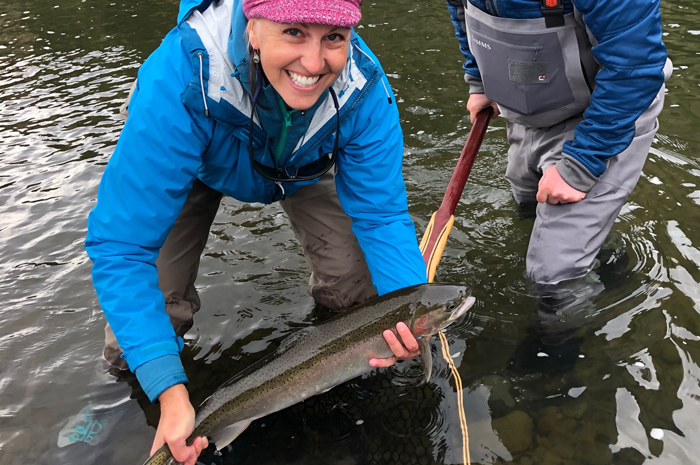 Silver Bow Fly Shop Guide Bjorn Ostby with guest Melissa K. and a beautiful steelhead