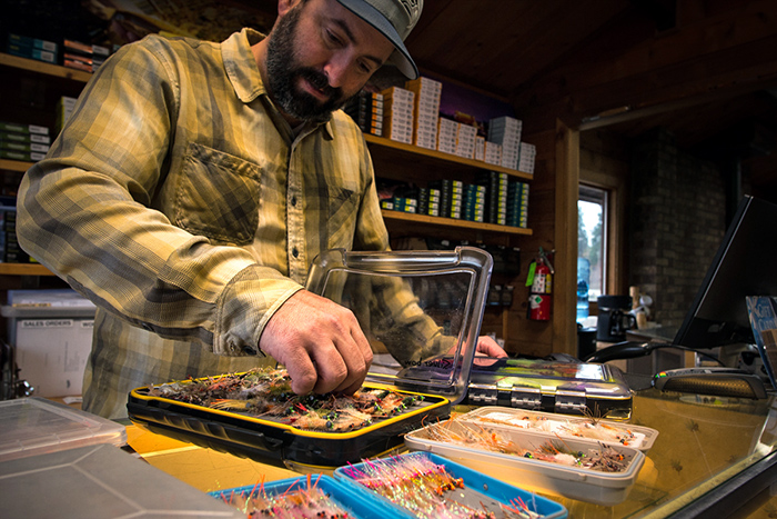 Bo Brand organizing his saltwater fly patterns for an upcoming hosted trip to Jardines de la Reina, Cuba.