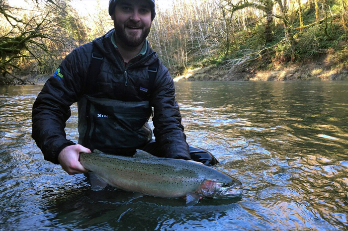 Kelby Braun with a hard fighting Olympic Peninsula steelhead.