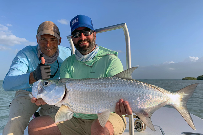 Bo Brand from the Silver Bow with a baby tarpon caught while fly fishing Jardines de la Reina, Cuba.