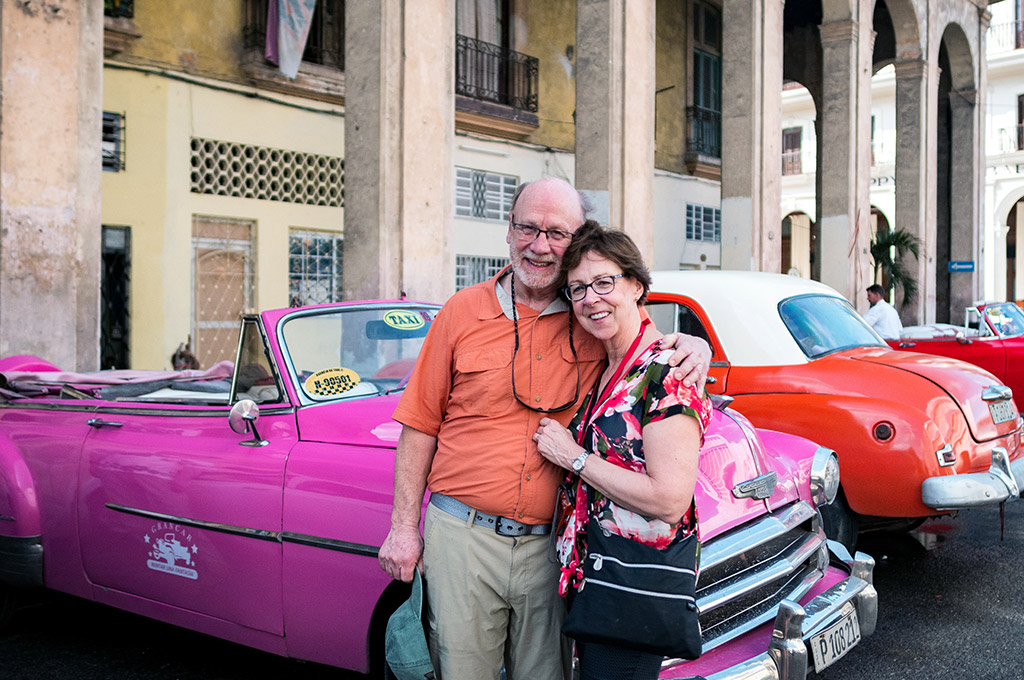 Nick and Pat infront of an old Chevy Taxi