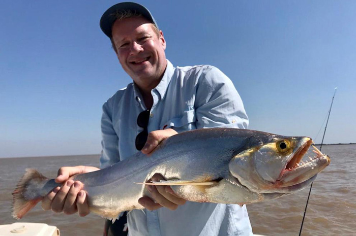 Kevin with a great vampire fish. Photo Credit - Urban Dorado Anglers / Kevin West