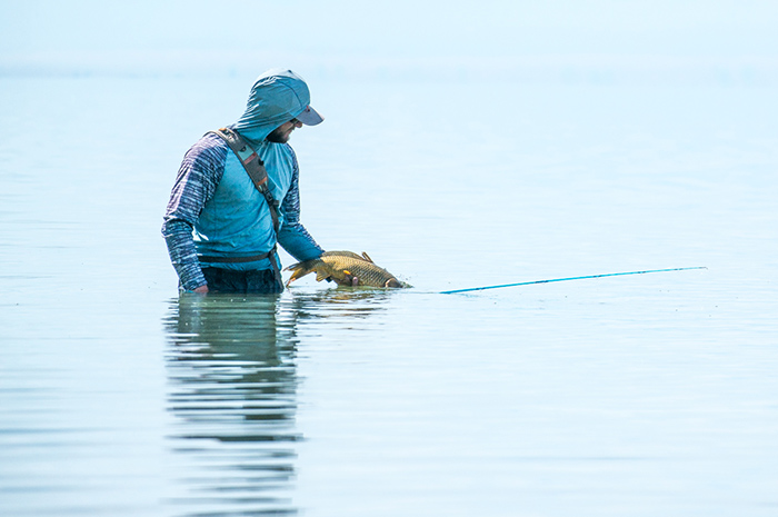 Kenyon Pitts releasing a carp in eastern Washington.