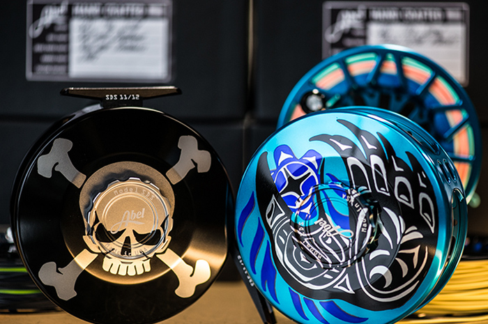 Custom Abel Fly Reels, Skull and Crossbones and the Abel Tribal Raven with extra spools.