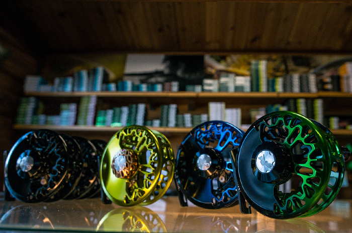 Custom Abel Vaya fly reels in black/blue fade, black/green fade and Olive with a classic brown trout drag knob.