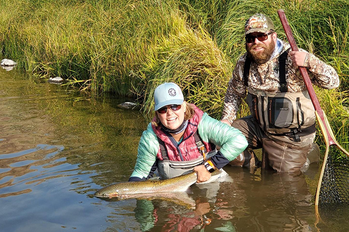Silver Bow Fly Shop guide Bjorn Ostby and United Women on the Fly guest celebrating a fantastic Grande Ronde steelhead.