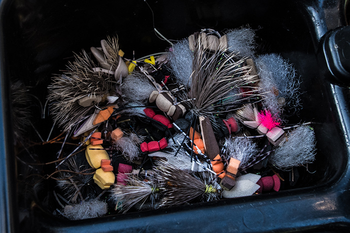 An organized mess of trout flies for typical Patagonia fly fishing.