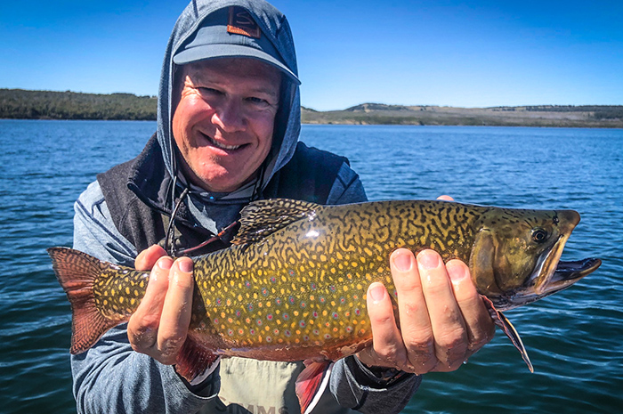 Angler Kevin West of Spokane with a beautiful fly caught brook trout from Engano Lake in Patagonia.