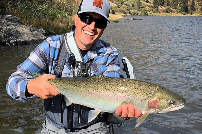 Sean Visintainer, Silver Bow Fly Shop owner, with a hatchery steelhead from the Grande Ronde River.