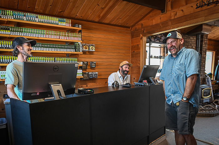 Silver Bow guide Britten Jay sharing laughs with Michael Visintainer and Bo Brand as they reminisce about his years of guiding the Spokane River.