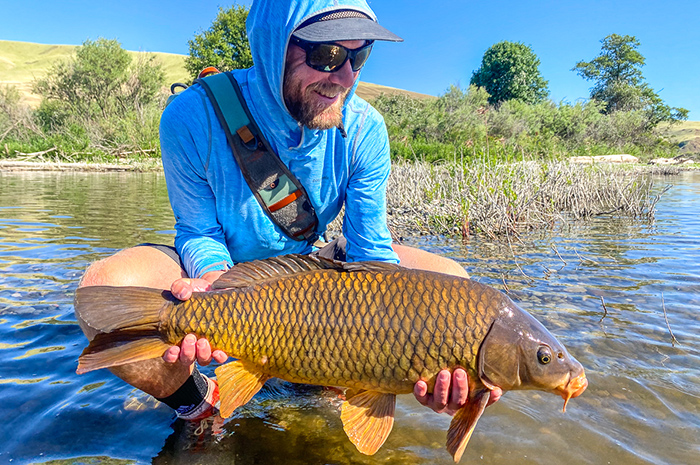 Angler Jesse Retan with a great eastern Washington carp caught on the fly.