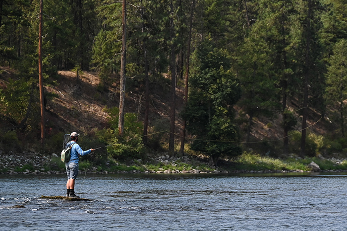 Fly fishing guide Kenyon Pitts casting on the Spokane River, Washington.