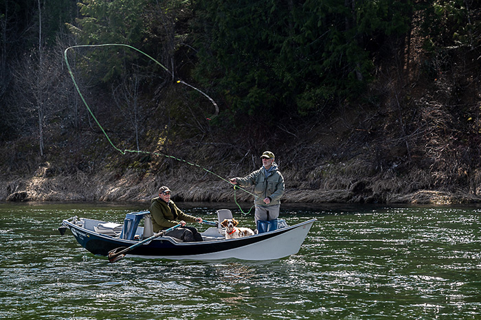 Anglers Rich Landers and David Moershel enjoying a day floating with the watchful eye of Ranger the bird dog.