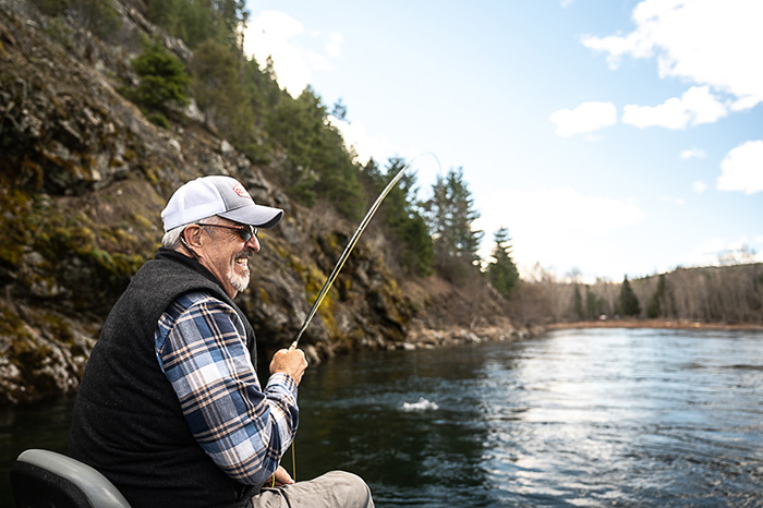 All smiles fighting a cutthroat trout on a fine spring day.